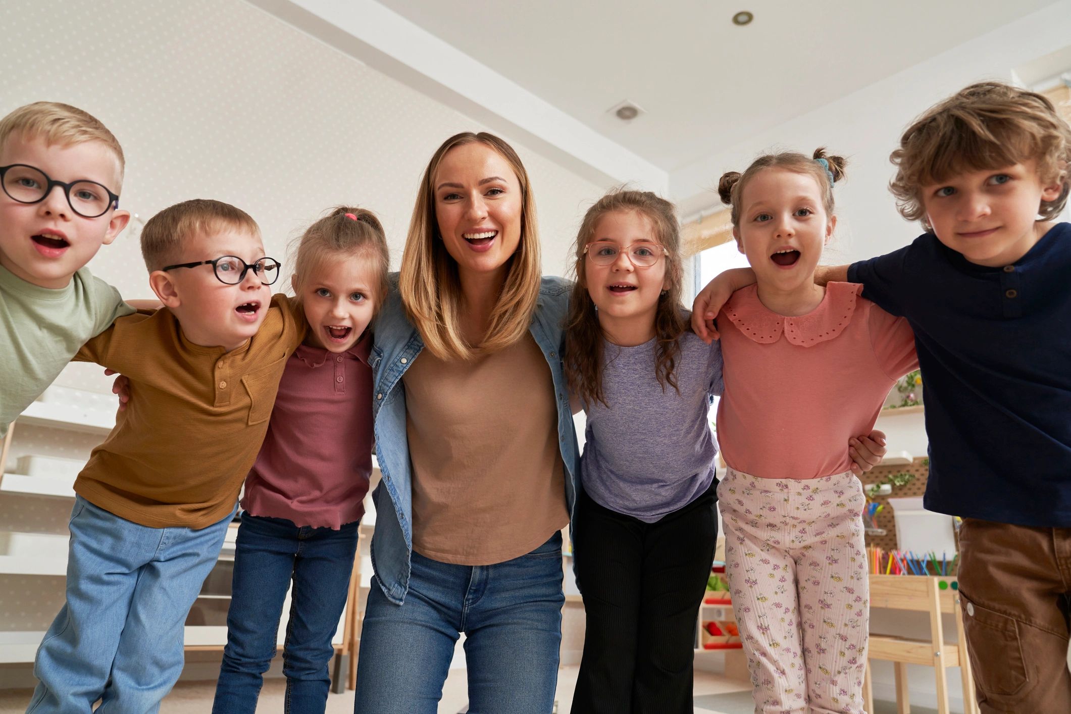 Preschool children with their teacher in a classroom