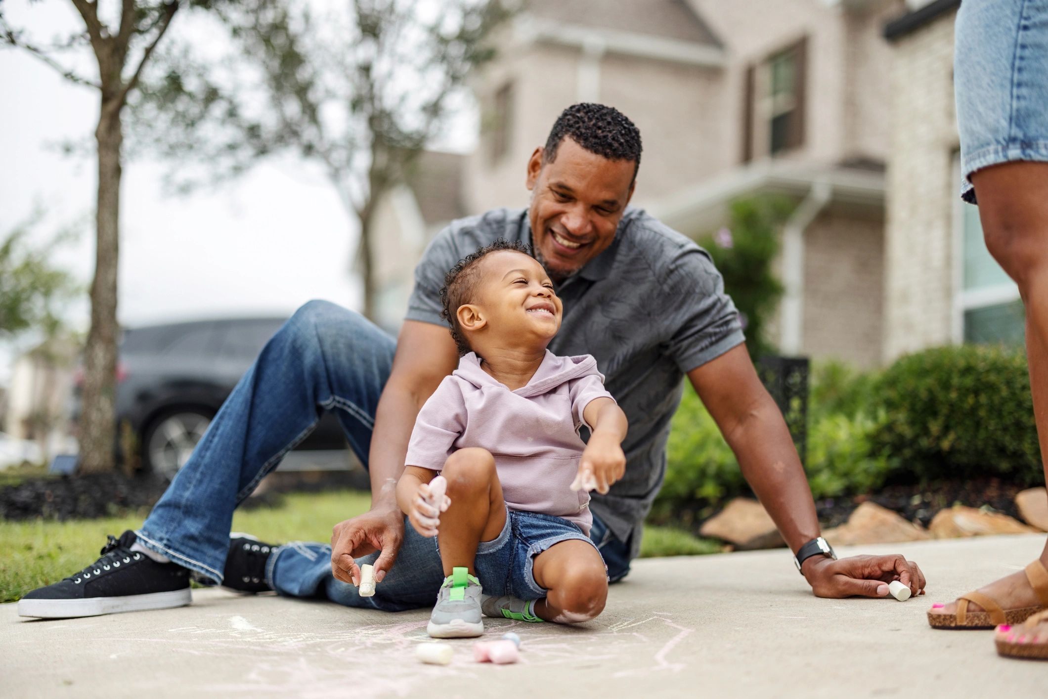 Parent and child sharing a happy moment outdoors