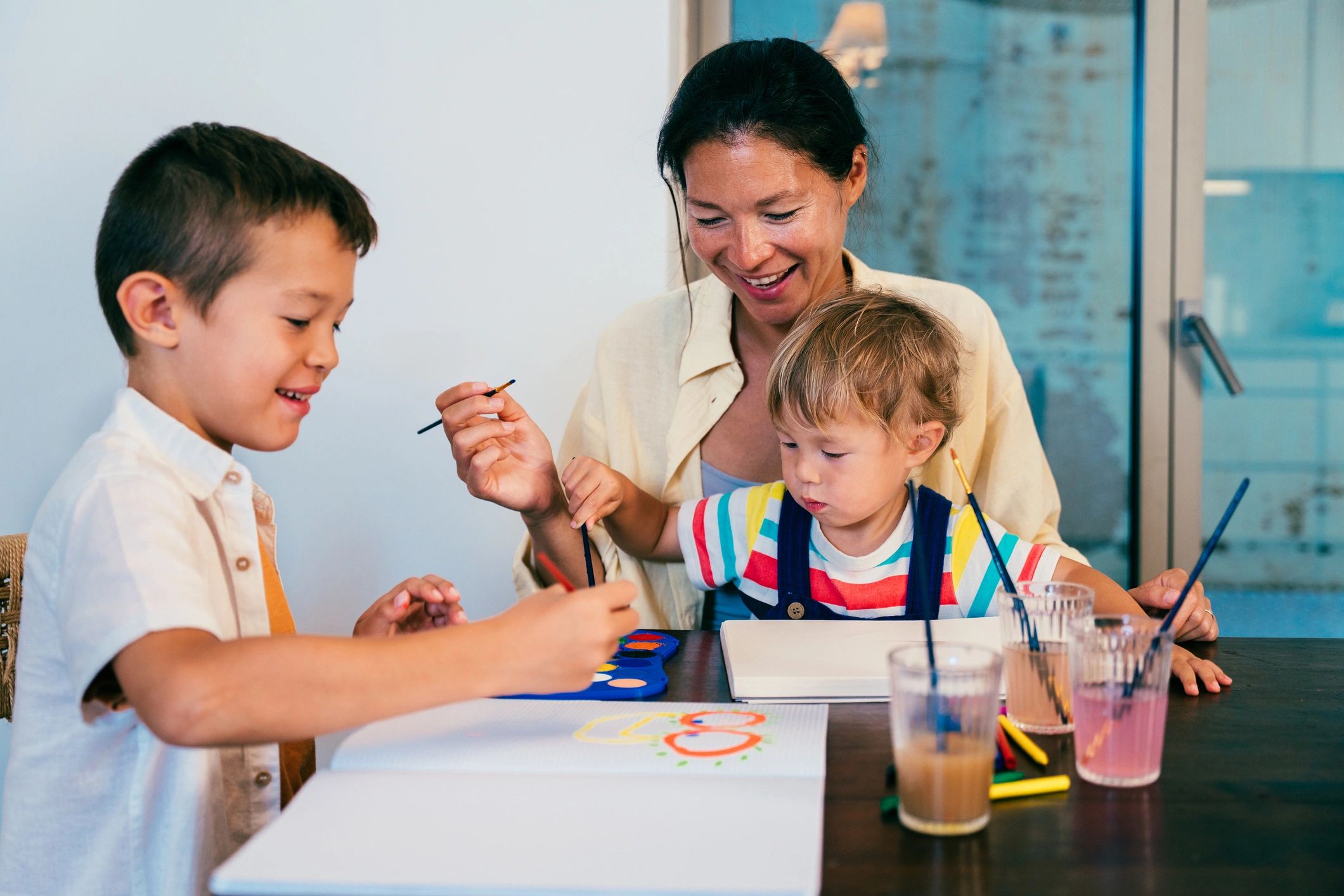 Children engaged in a colorful painting activity
